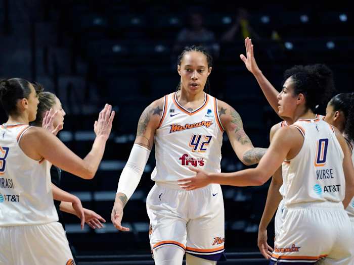 Phoenix Mercury’s Brittney Griner is congratulated by teammates in a game from 2021.